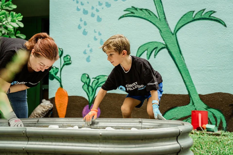 Two volunteers working on an outdoor project.